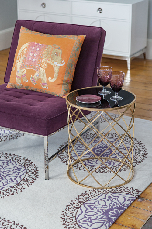 Purple Velvet Chair Orange Elephant Pillow and Black Glass amp Metal Side Table